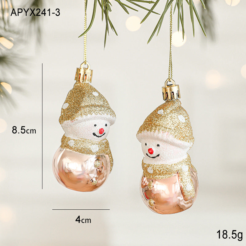 Gold and rose gold glitter snowman ornaments on hanging cords, close view of two