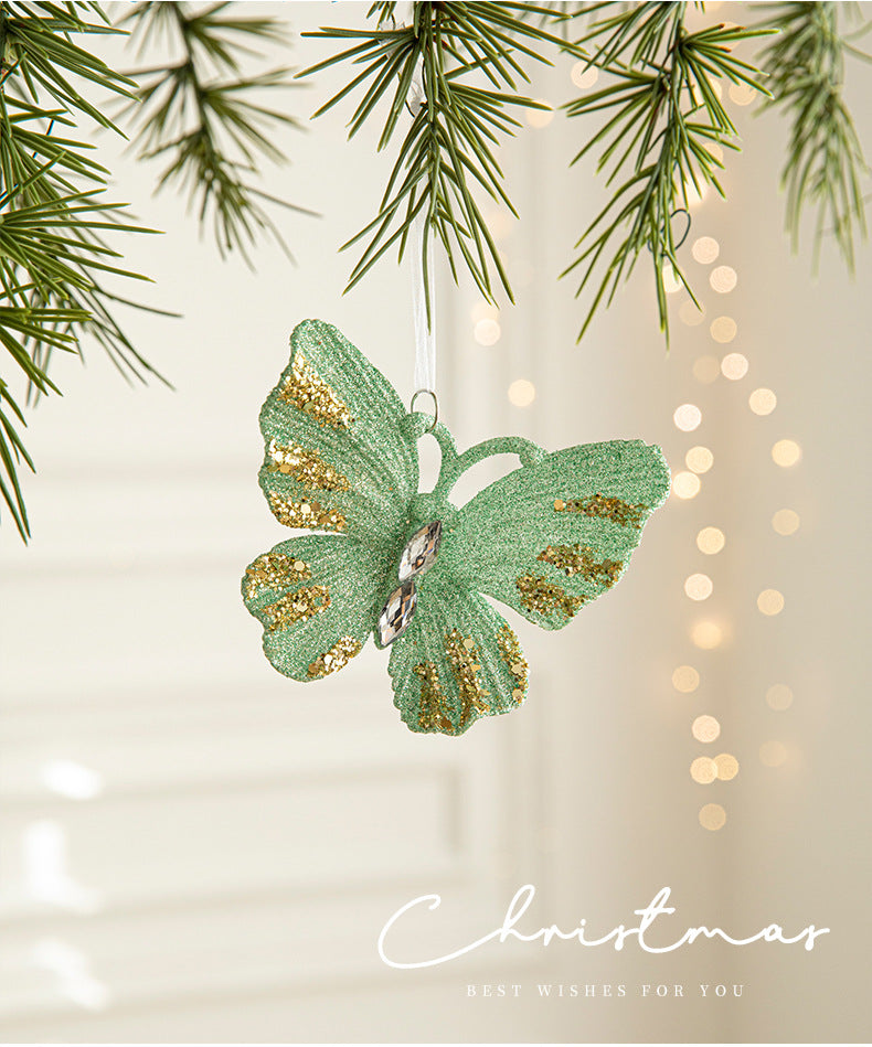 Hanging green glitter butterfly ornament with gold speckles and stitched body