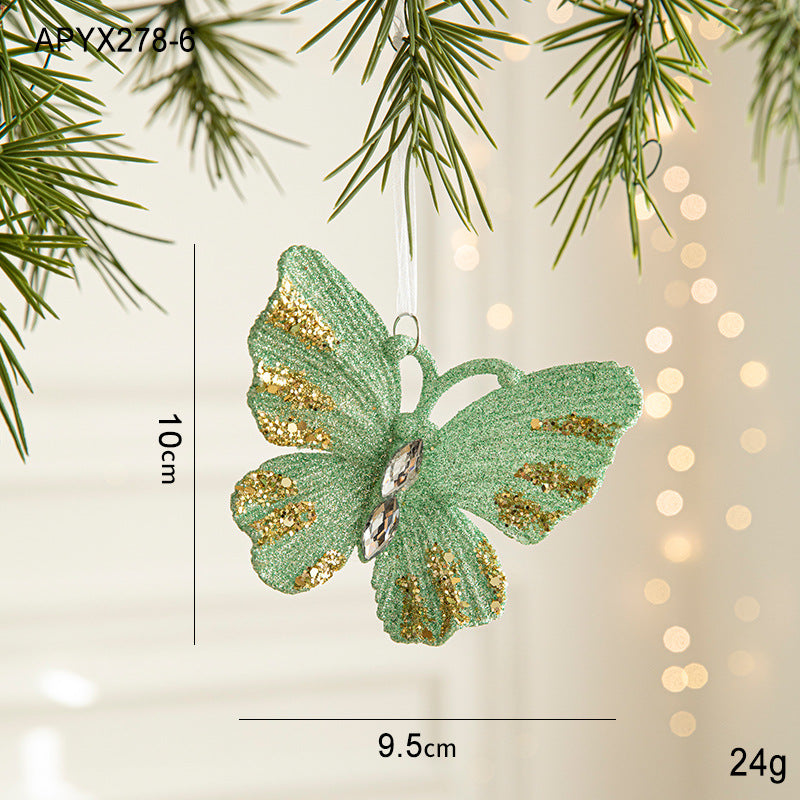 Green glitter butterfly ornament with gold accents, hanging loop; 9.5cm x 10cm