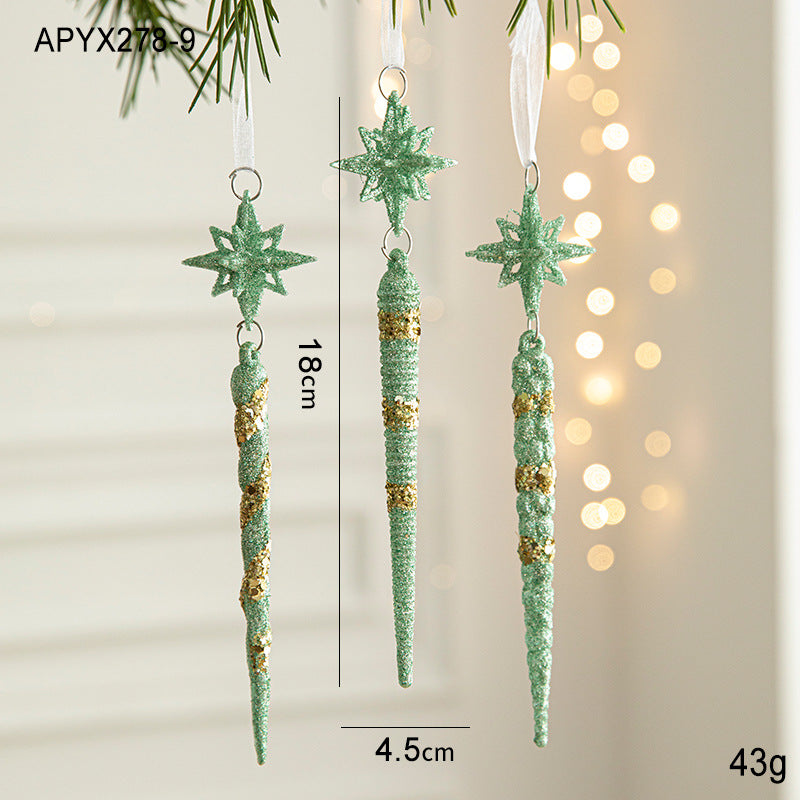 Three green glitter icicle ornaments with star tops and hanging loops