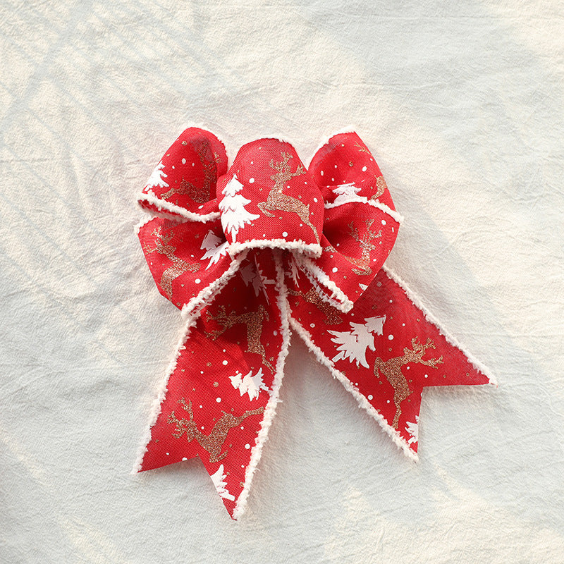 Christmas wired ribbon bow in red with white tree and reindeer print