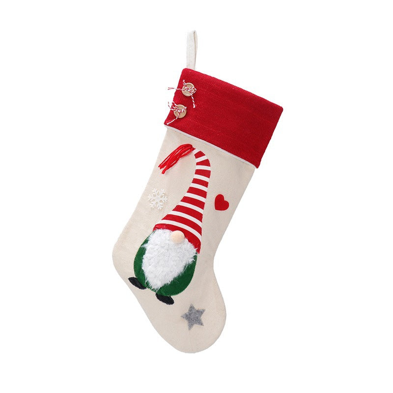 Christmas gnome stocking with red hat, striped candy and green boot detail