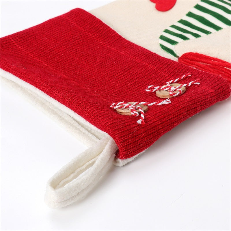 Red knit cuff with stitched bow detail on beige gnome stocking