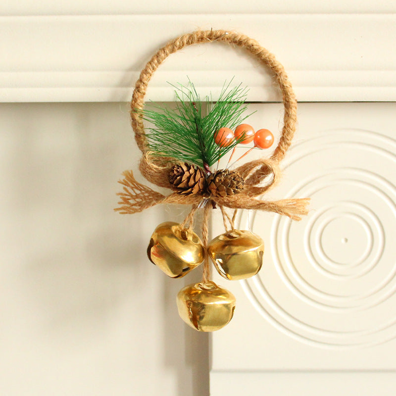 Rustic Christmas ring ornament with jute loop, green pine picks, pinecones and gold bells