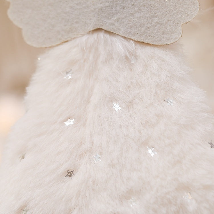 White fluffy angel dress detail with small glitter accents