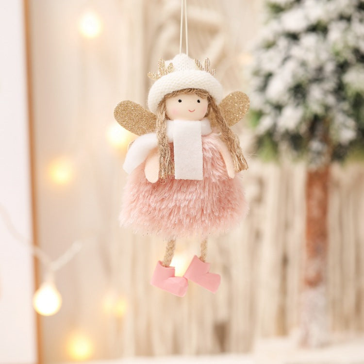Hanging angel ornament with pink fuzzy dress, white scarf, and gold glitter wings