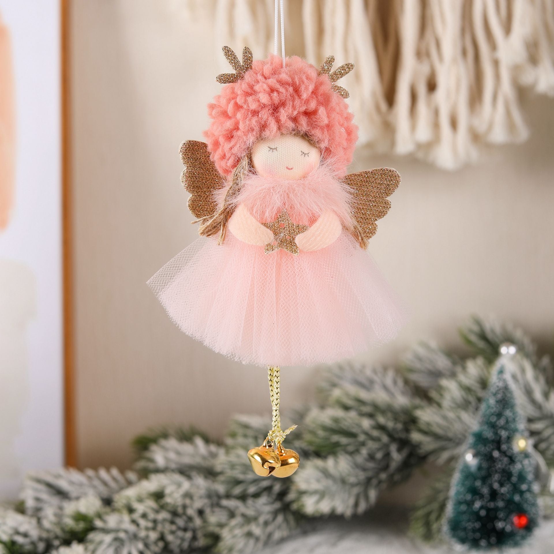 Pink angel ornament with fluffy hat, gold wings, tulle dress, and hanging bell dangle