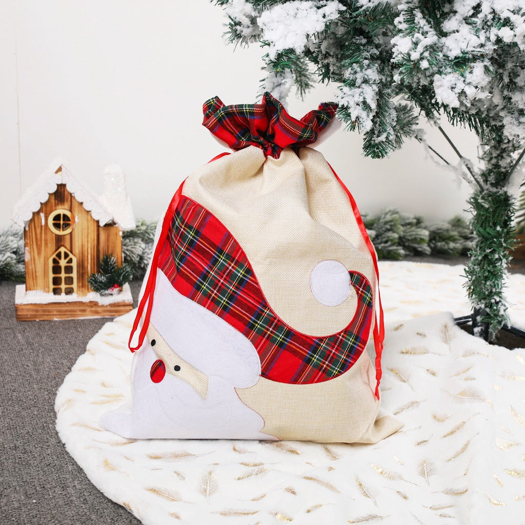 Santa Claus drawstring gift bag, cream fabric with red plaid patch and white applique