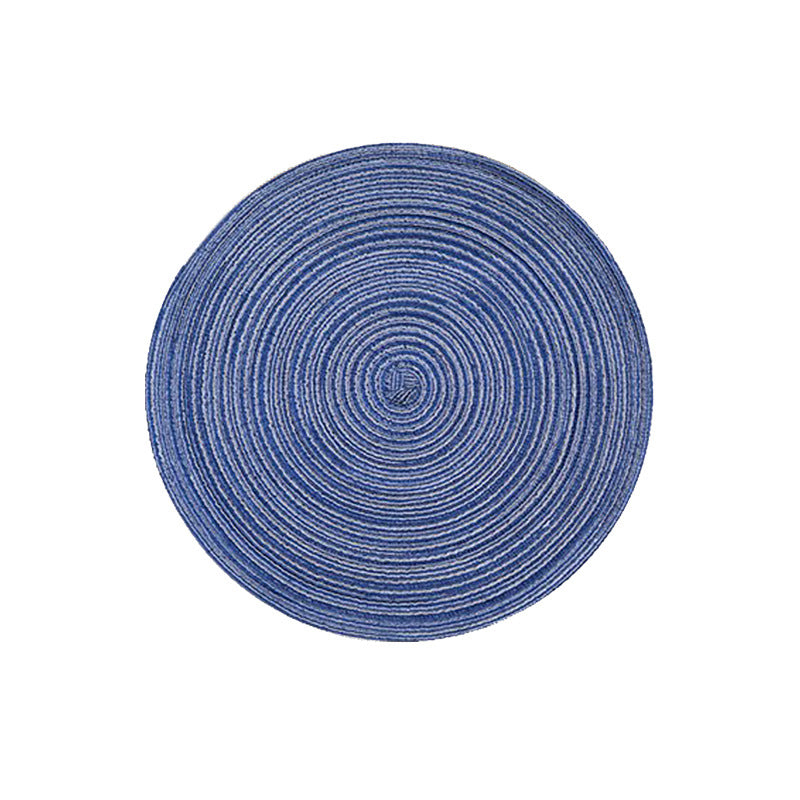 Round woven placemat, circular blue braided texture with concentric swirl pattern