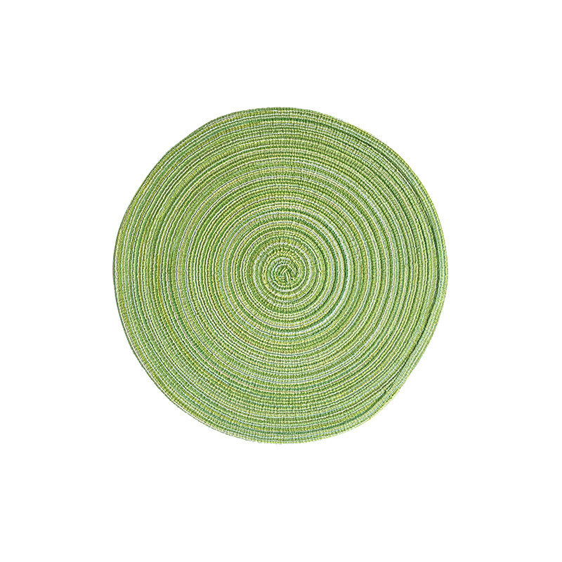 Green round woven placemat with concentric braided ring pattern