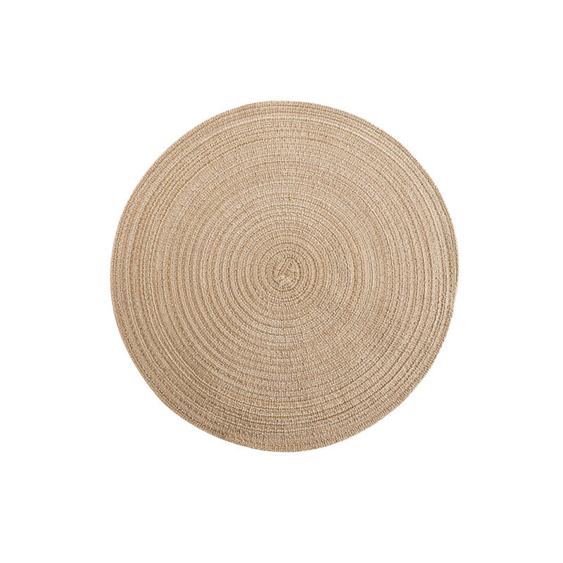 Round woven placemat, beige with spiral concentric weave.