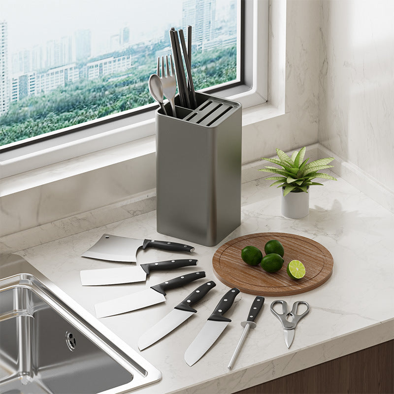Square knife holder with vertical slots, holding several knives