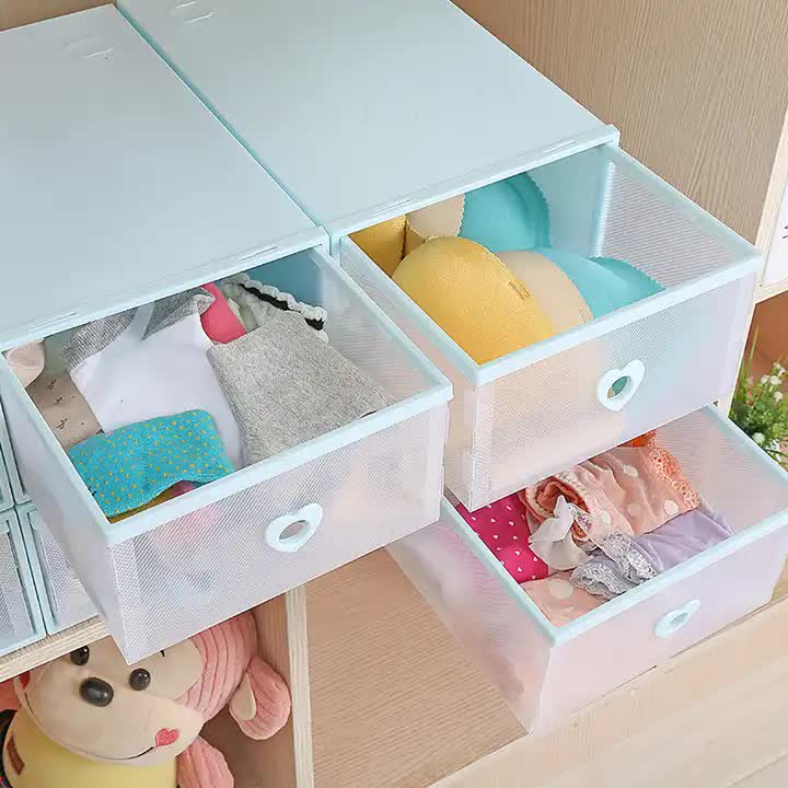 Stackable transparent shoe storage boxes with heart-shaped handles, open compartments with shoes