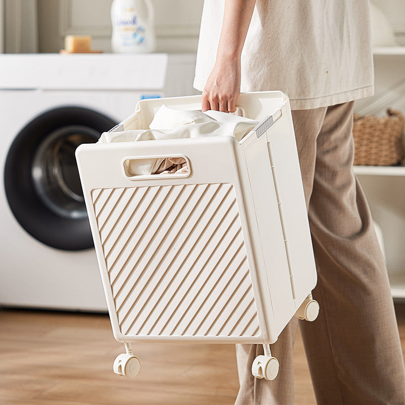 Cream rolling laundry hamper with front slat panel and side carry handle