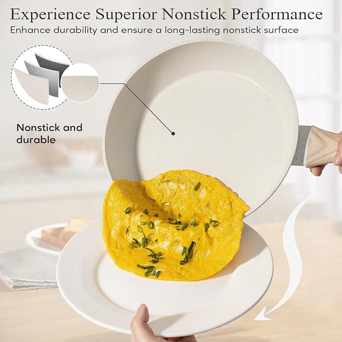 Wood-handled nonstick frying pan holding a plated omelet