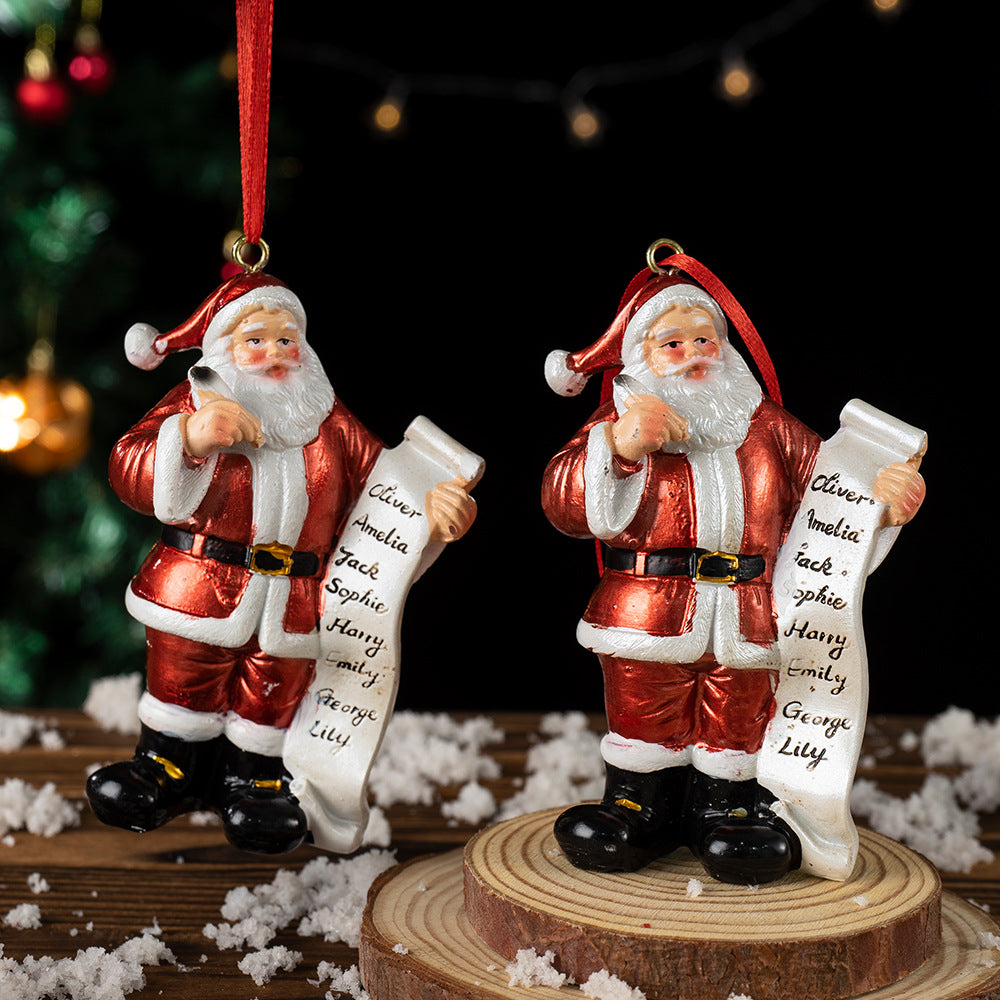 Pair of Santa Claus resin ornaments with white name list scrolls, red suits and hanging cords