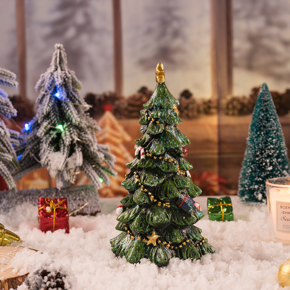 Decorative green resin Christmas tree figurine with gold topper and hanging bauble details