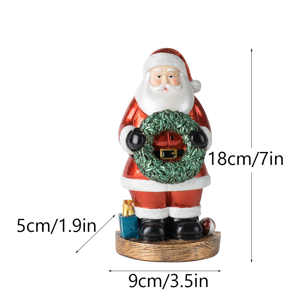 Santa Claus figurine with green wreath, wooden base; 18cm tall