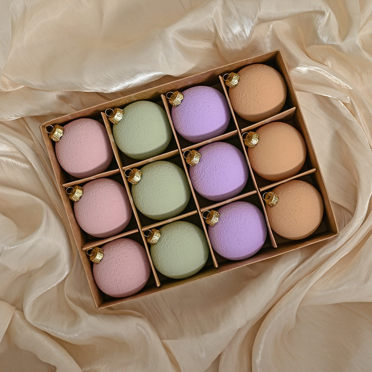 Matte Christmas bauble set in a wooden tray, pastel matte spheres with gold caps
