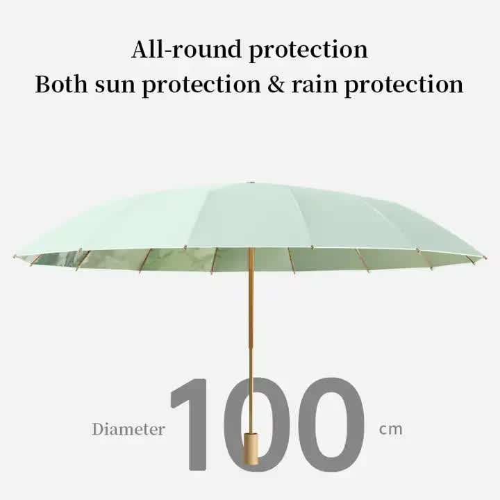 Open light green folding umbrella with gold center pole and straight ribs