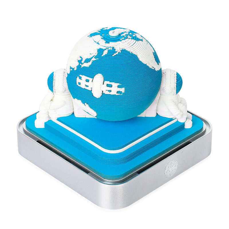 Blue paper globe night light sculpture on silver base with memo pad cover