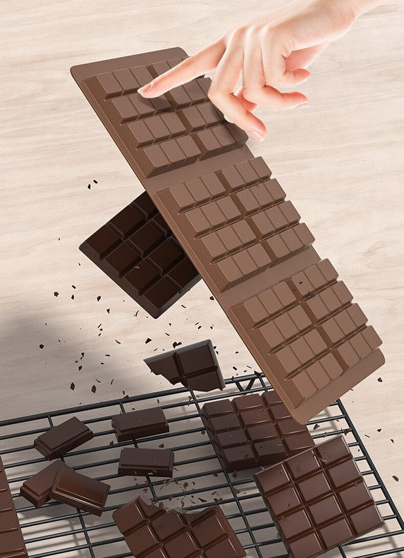 Silicone chocolate bar mold with rectangular cavities, hand lifting molded chocolate bars