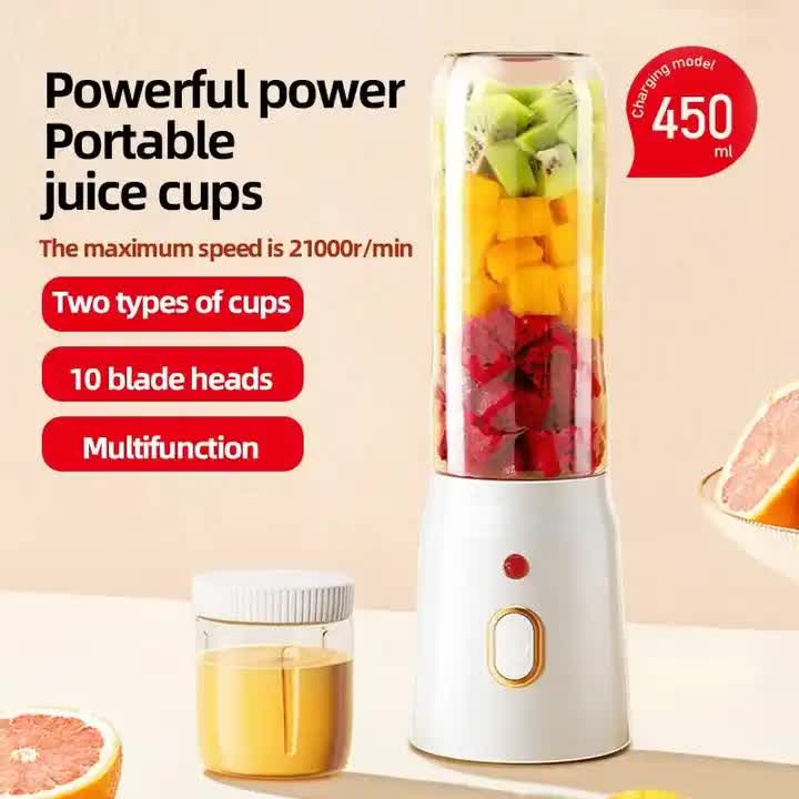 Portable blender with clear jar and white base, showing fruit inside