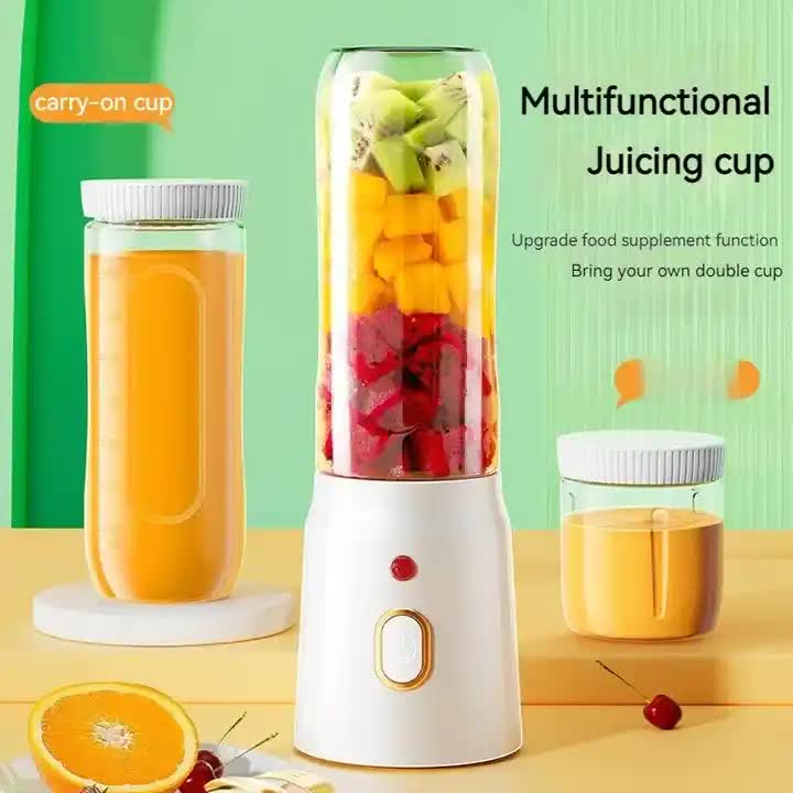 Portable blender with carry-on cup and clear juicing cup on white base
