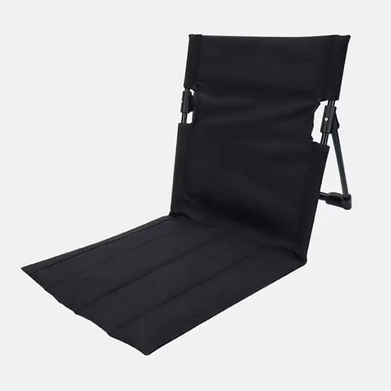 Black folding lawn chair with backrest and padded seat, straight legs and side straps
