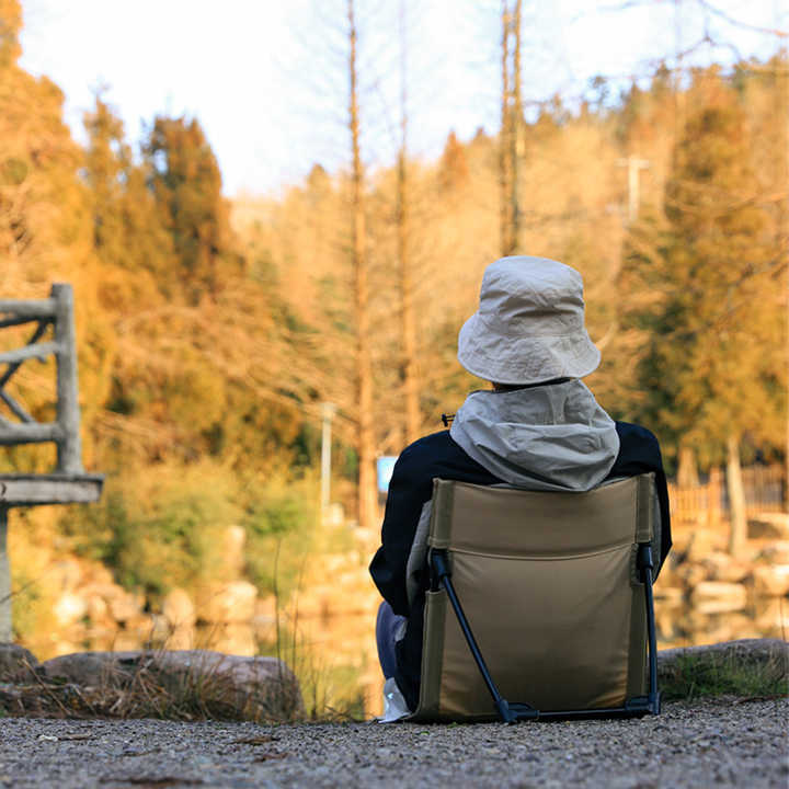 Olive folding outdoor chair with backrest and padded seat, collapsible metal legs