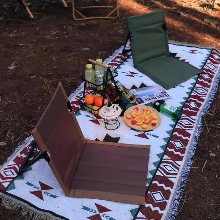 Olive green folding lawn chair with backrest in outdoor lounge setup