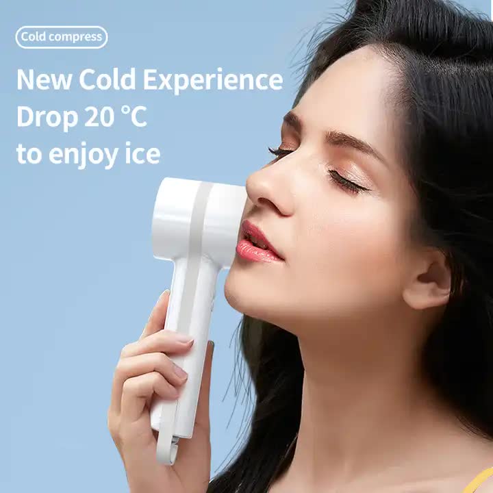 White handheld mini cooling fan near face, angled for cooling