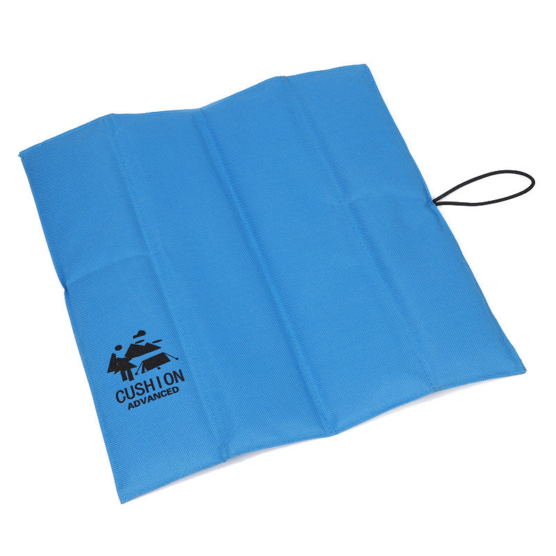 Blue foldable waterproof picnic seat pad, compact with carry cord loop