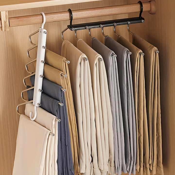 Multi-layer pants hanger with wooden top bar and metal hooks, holding trousers