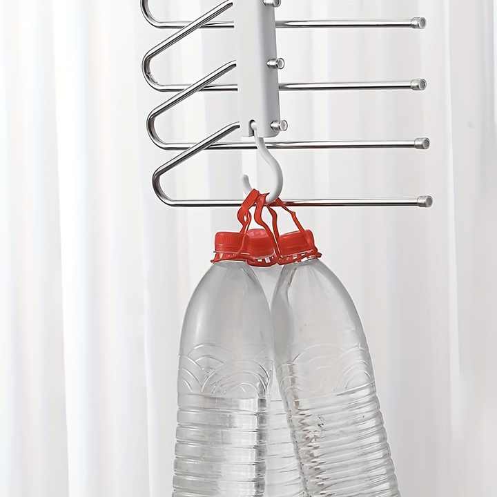 Multi-layer pants hanger with several horizontal metal bars and round garment clips