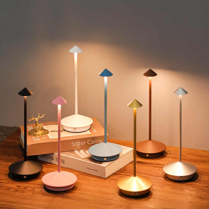 LED mushroom night lights set with round bases in pink, blue, black, and gold