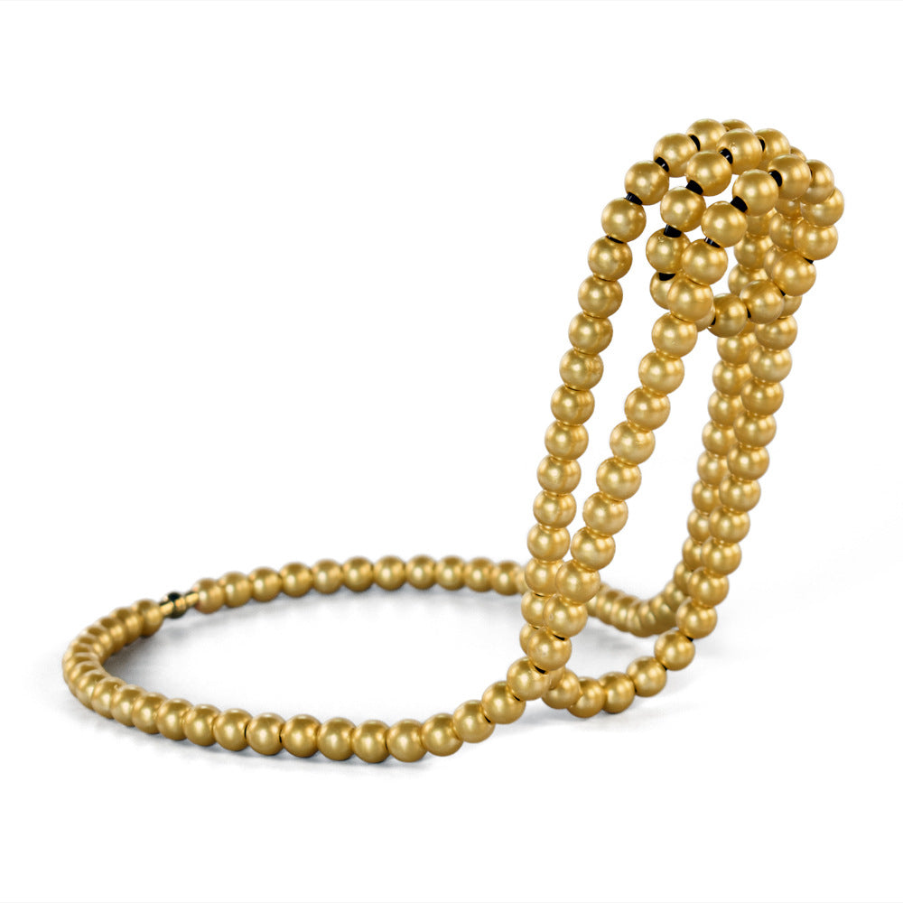 Gold beaded rope wine bottle holder with floating-loop design