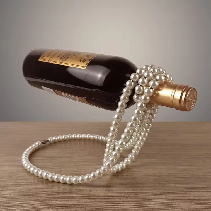 White pearl bead wine bottle holder with gold-toned connector and coiled loop