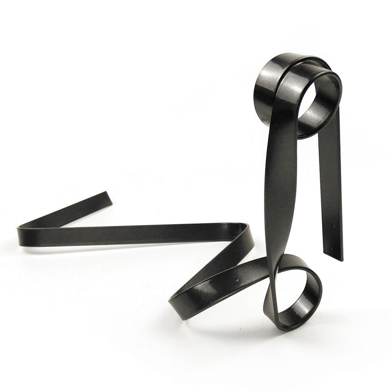 Black metal wine bottle holder with ribbon-style loops and two base supports