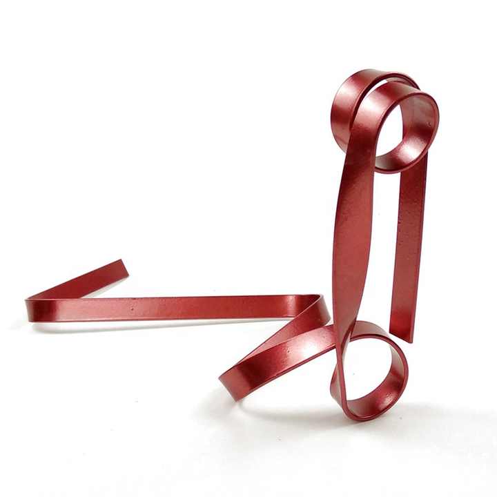 Red metal wine bottle holder with ribbon loops and flat base supports