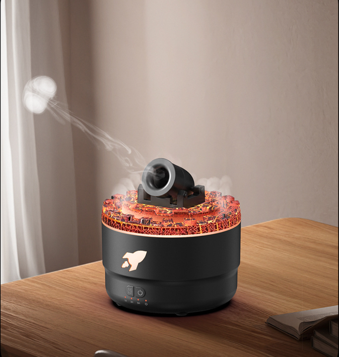 Black cannon-shaped aromatherapy diffuser with colorful LED top ring and mist nozzle