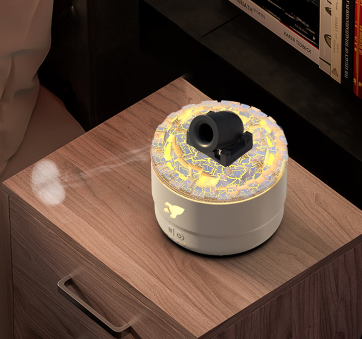 Desktop aromatherapy diffuser with candle-like top and mosaic LED ring, rear nozzle