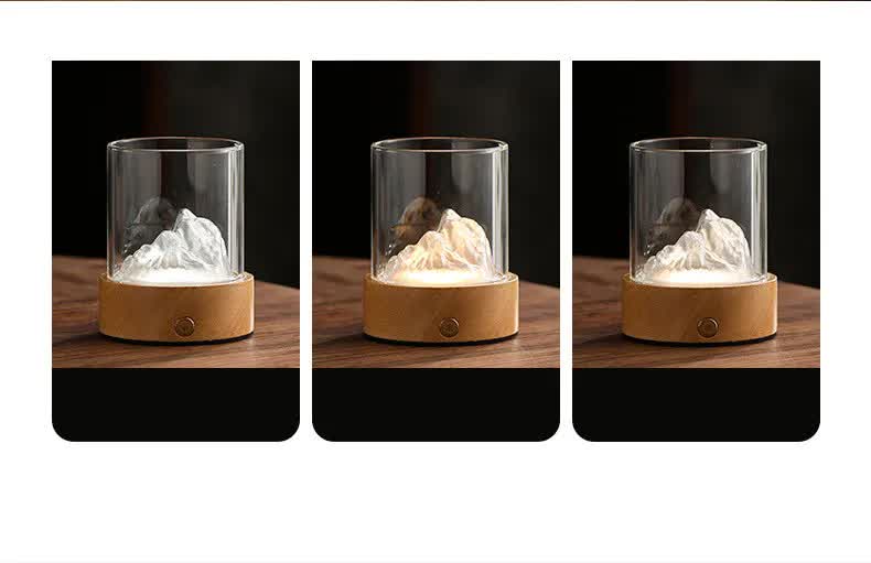 Mountain night light showing three light colors in a clear glass cylinder