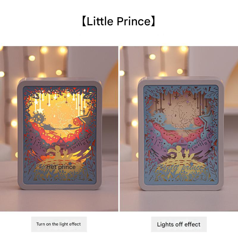 3D paper night light with Little Prince scene, warm yellow glow in front window