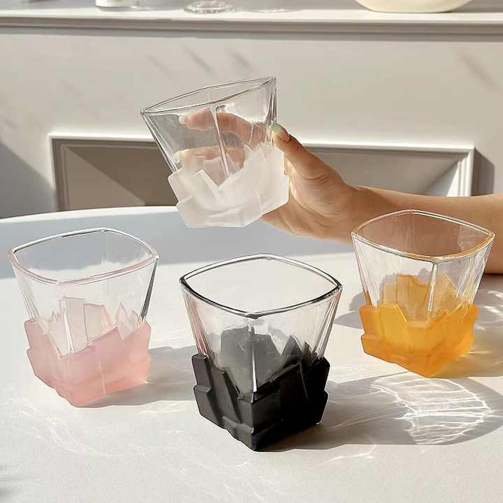 Frosted ice-cube textured glass tumbler set with pink, black and orange cups