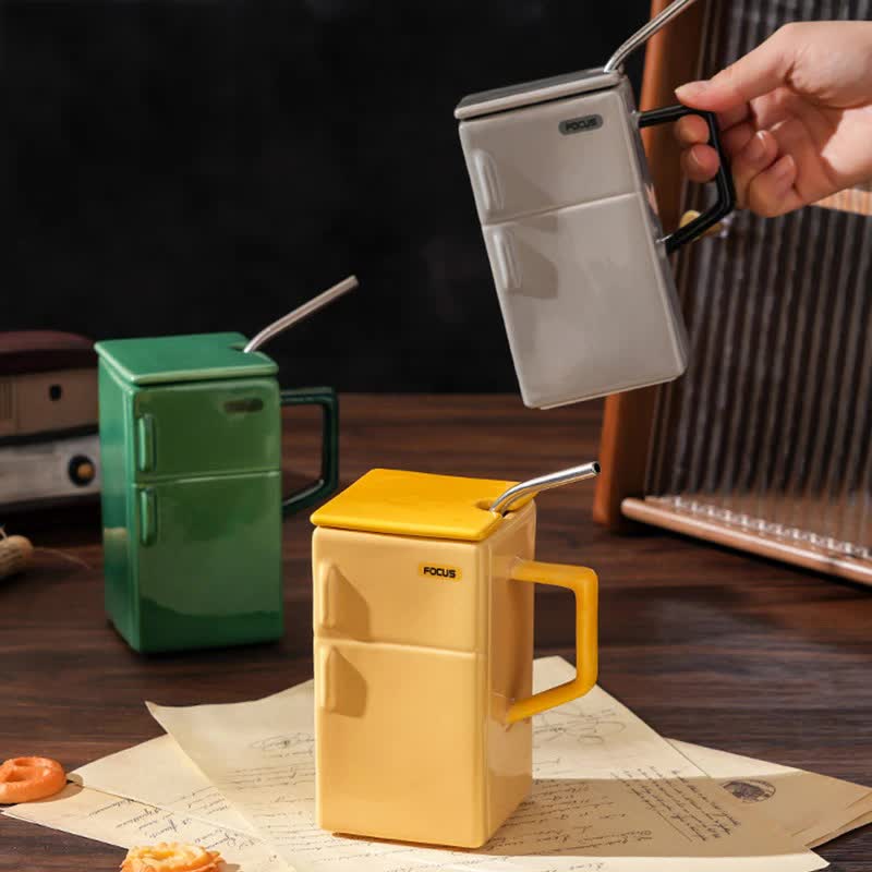 Ceramic refrigerator-style mugs in yellow and grey with lids and straws, side handles