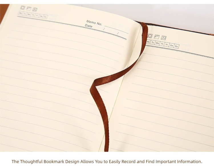 A5 notebook open with lined pages and brown ribbon bookmark near spine
