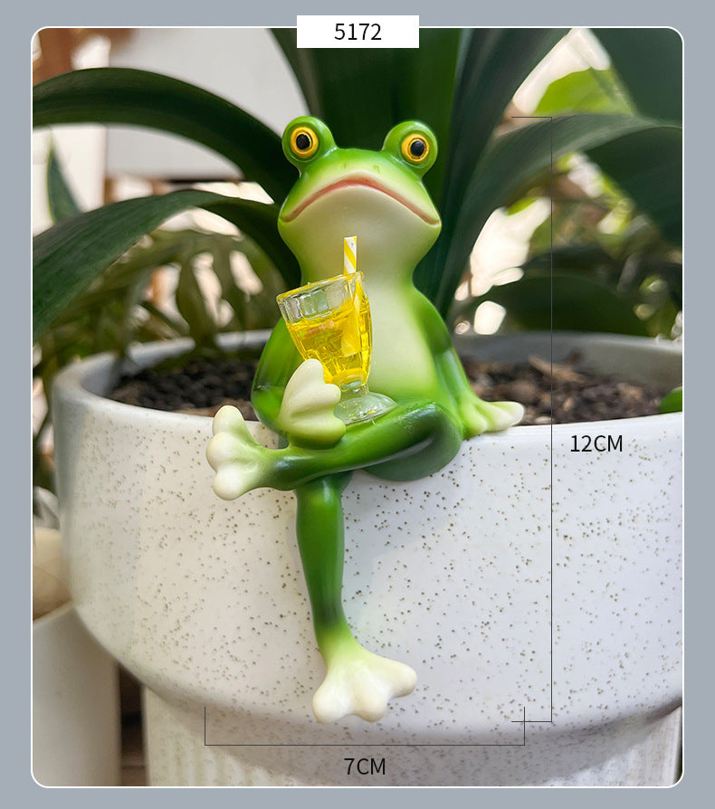 Green frog pot hanger ornament with crossed legs and yellow drink glass