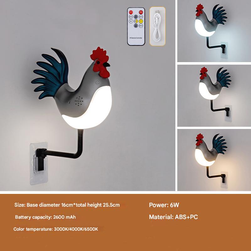 Rooster wall lamp with blue tail, red comb, glowing white bulb and black wall arm
