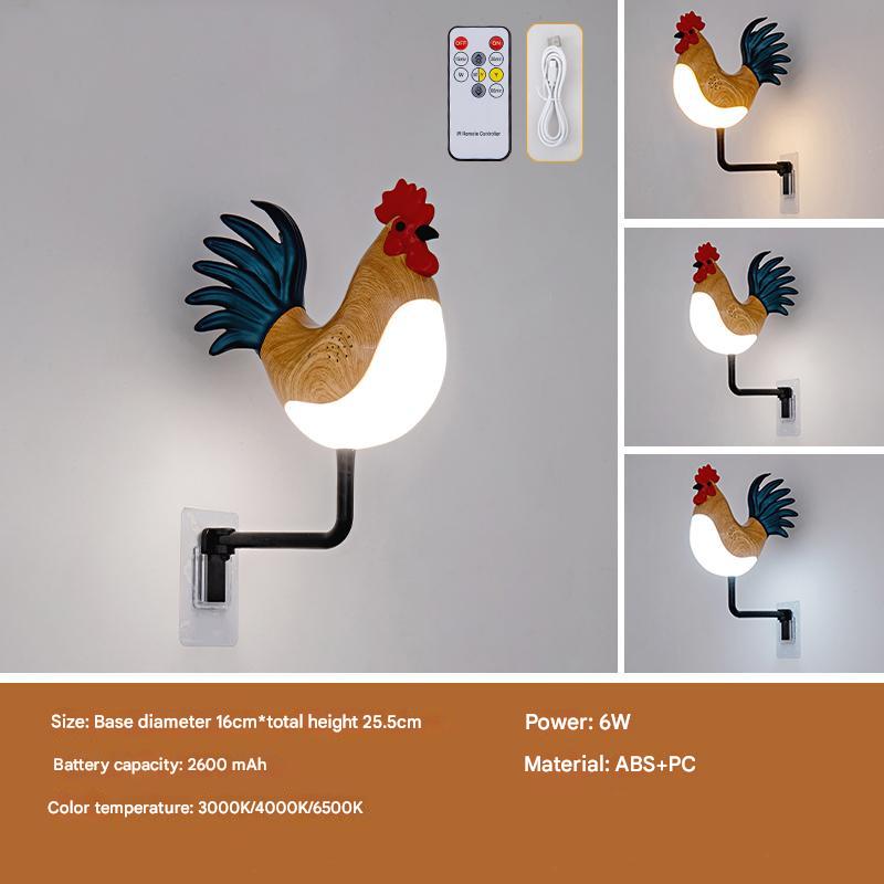 Rooster wall lamp with yellow wooden body, blue tail, red head, glowing bulb on black arm